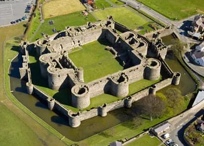 Aerial view of Beaumaris Castle, showing multiple layers of walls for defense. Crown copyright 2016