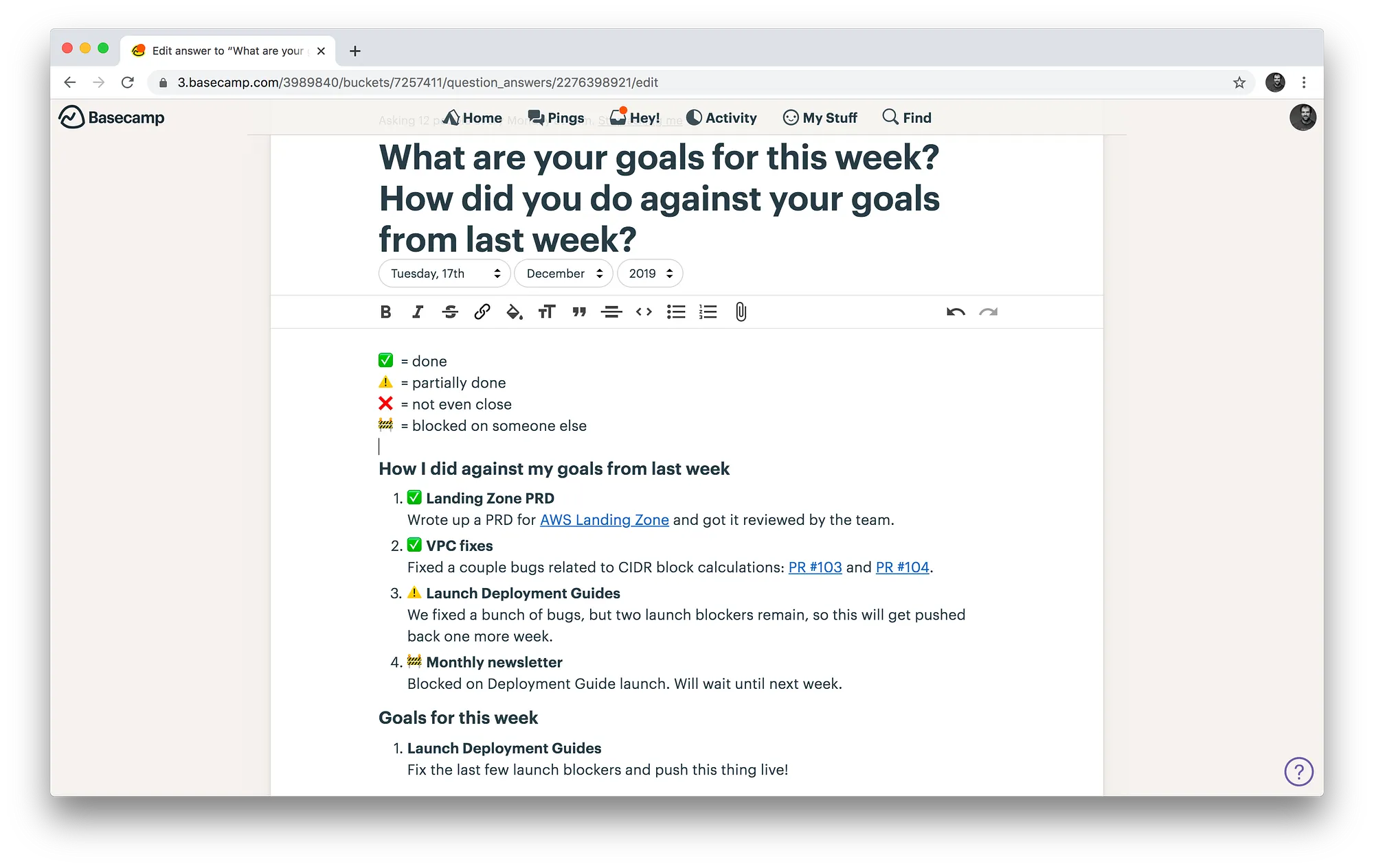 Screenshot of a Basecamp weekly check-in document listing goals and progress using checkmark, warning, and blocked emoji.